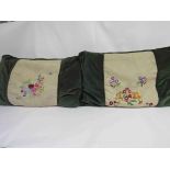 A pair of green velvet feather filled cushions,