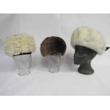 An Edna Wallace beige moleskin fur hat,