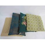 Four assorted cushions including needlepoint and paisley