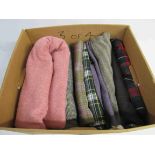 A box of tweeds and tartan fabrics