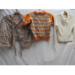 Three items of 1930's clothing, knitted orange jumper, short sleeve with bands of blue and cream,