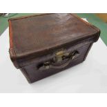 A late 19th early 2oth century vintage brown leather travelling hat box inscribed on lid J. W.
