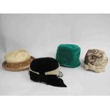 Three Christian Dior hats including emerald velvet cloche,