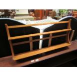 An Ercol two tier wall hanging plate rack,