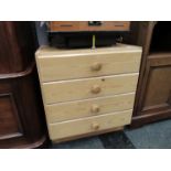 A modern pine chest of four drawers,