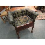 An Edwardian mahogany quarter veneered dressing table stool the single base drawer on pad foot