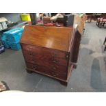 A George III mahogany four drawer bureau with key on bracket feet,