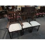 A set of six (4+2) dining chairs with upholstered seats,