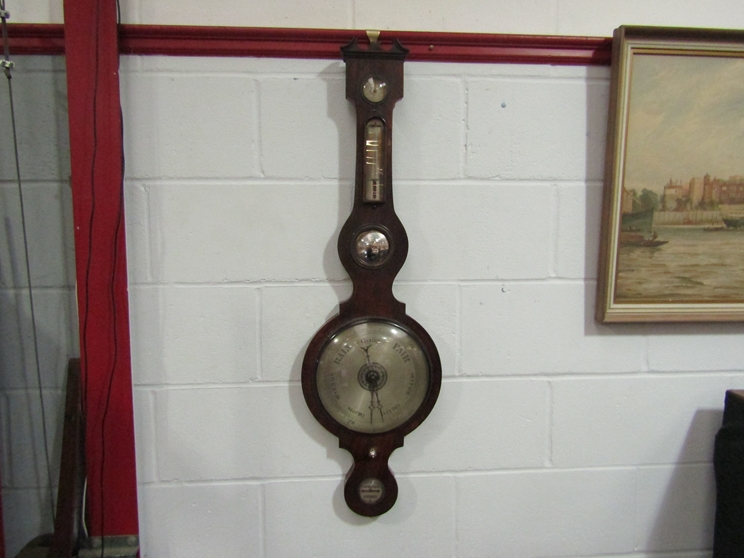 A mid to late 19th Century mahogany five dial wheel barometer