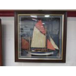 A framed diorama of a ship