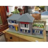 A Tri-ang dolls house with furniture,