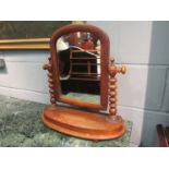 A Victorian mahogany dressing table mirror with bobbin turned supports,