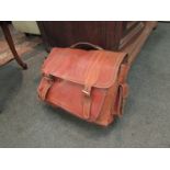 A brown leather satchel briefcase