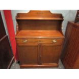 A Regency style mahogany chiffonier with raised shelf back and holly inlaid decoration the single