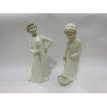 Two Nao figures girl & boy in night attire,