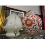 A white and orange ground lidded baluster form ginger jar and a glass ceiling light (2)