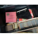A tin trunk containing a quantity of assorted children's puzzles and games to include Gobby Goose,