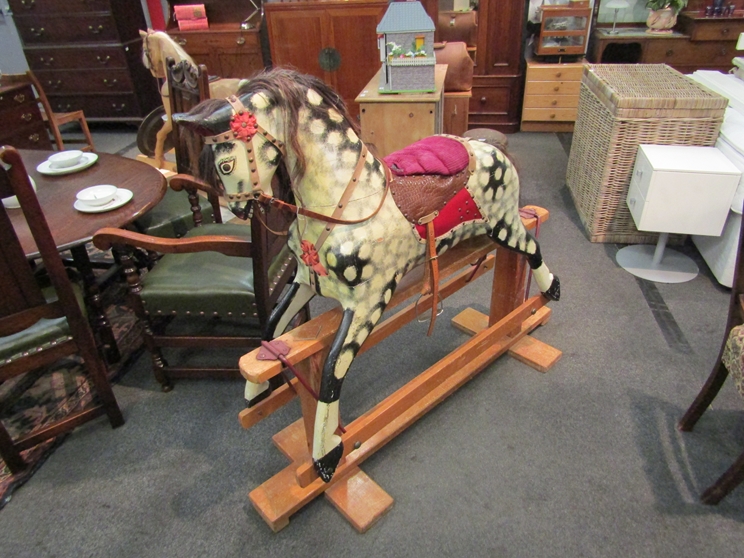 WITHDRAWN - A painted dapple Collinson early 20th Century rocking horse on trestle rocker,