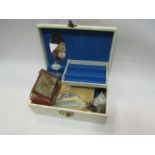 A musical jewellery box with coins,