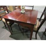 A mahogany tea table with arched supports,