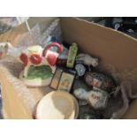 A box containing assorted items including a 19th Century cow creamer, a porcelain patch box,