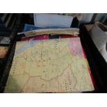 A tray of mixed road maps