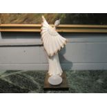A female figure candle stand,