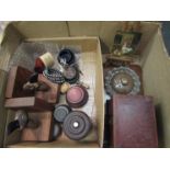 A box containing miniature assorted items including blue glass liners, trophy stands,