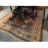 An Indian blue and red rug, worn,