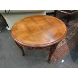 A French style parquetry circular top occasional table on carved cabriole legs,