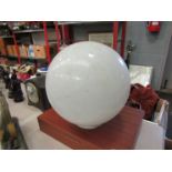 A white spherical glass shade