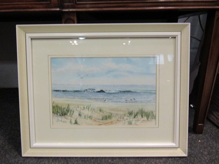 JOHN WAINE: A watercolour of Norfolk coast, framed and glazed,