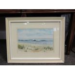 JOHN WAINE: A watercolour of Norfolk coast, framed and glazed,