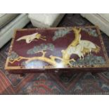An Oriental lacquered rectangular top occasional table on cabriole legs,