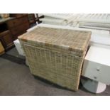 A lidded wicker basket,