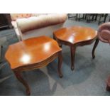 A pair of French style serpentine top lamp tables on carved cabriole legs,