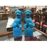 Two blue glazed dogs of Fo, 25cm tall,