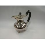 A JSS marked silver plated hot water jug, footed base,