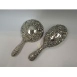 A silver backed hairbrush and hand mirror,