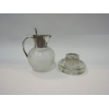 A glass table vesta with silver rim marked Chester and a ribbed glass jug with plated top