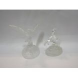 A glass owl figure and glass horse figure