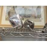 A pair of chromed motorcycle mirrors