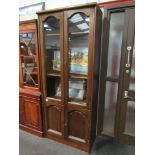 A modern oak effect slim glazed cupboard on two door base,