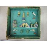 A boxed set of 20th Century Chinese tourism clay figures to include a pagoda, bridge, frogs,