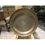 A large Eastern brass round serving tray,