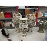 A pair of Oriental vases and another,