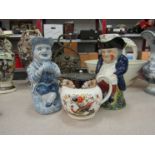 Two Toby jugs including French blue and white example and a Woods bird and foliage design jug