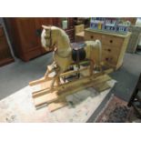 A Timber and Thread carved limewood rocking horse with real horsehair mane, forelock and tail,