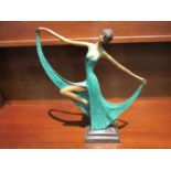 A cast metal Deco dancing figure,