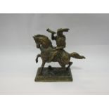 A cast brass figure of a Native American on horseback,